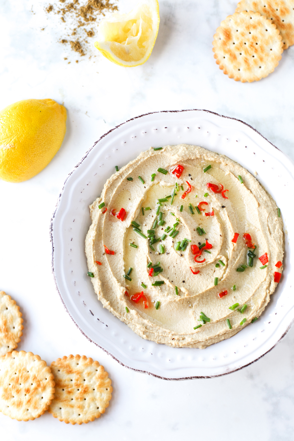 Hummus sprinkled with herbs and chilli