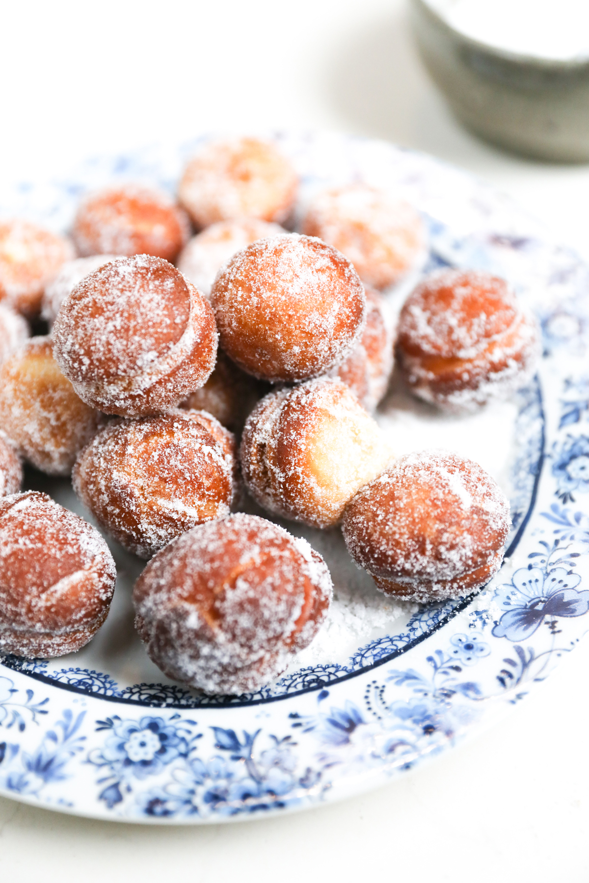Doughnuts dusted in caster sugar up close